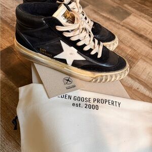 Golden Goose Black and White Sneakers with Gold Accent